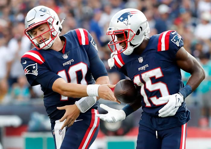 Patriots QB Mac Jones (10) and WR Nelson Agholor (15)